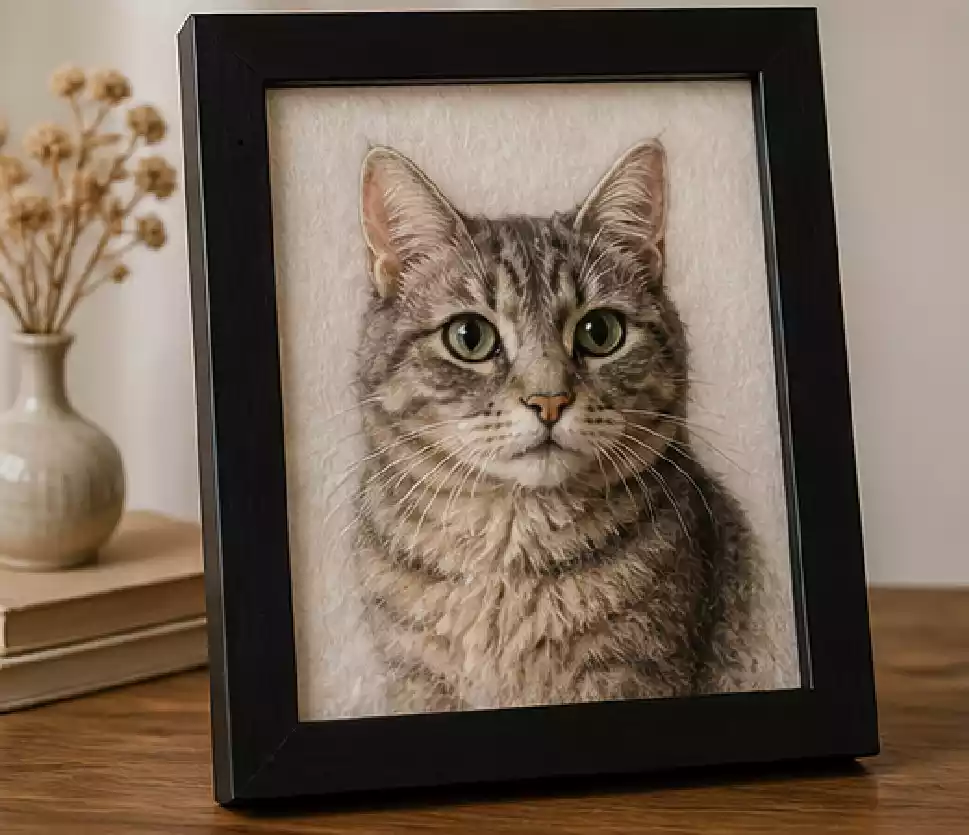 PawWool founder holding a finished needle felted wool pet portrait